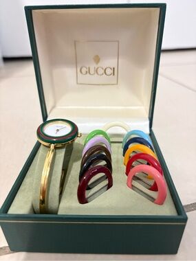 Gucci Gold-Tone Bangle Watch with Multicolor Interchangeable Bezels